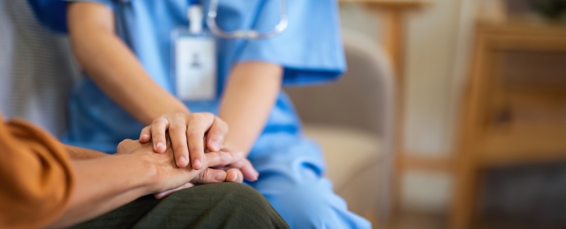 Nurse comforting patient