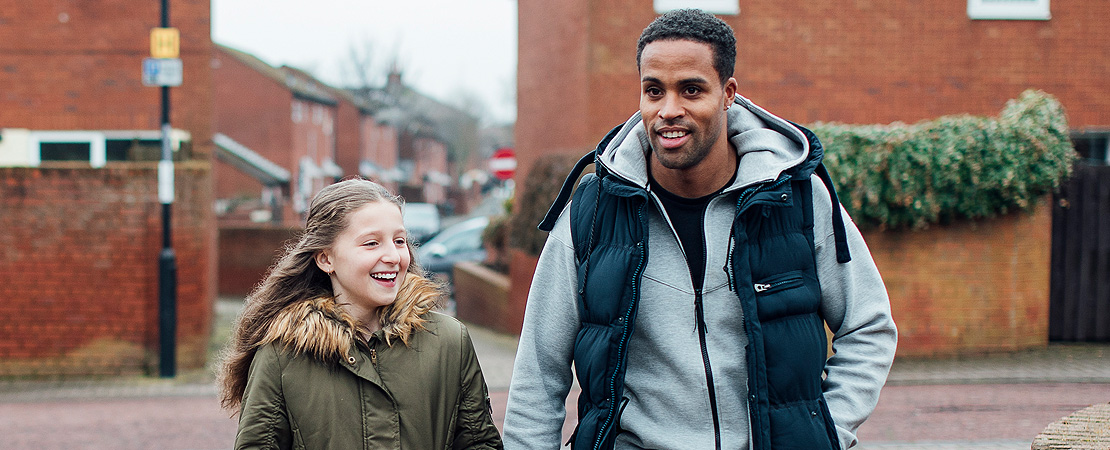 father and daughter walking