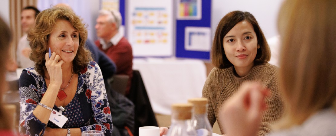 Two SCW members of staff at a workshop