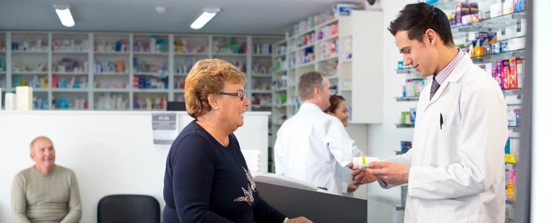 a pharmacist talking to a customer