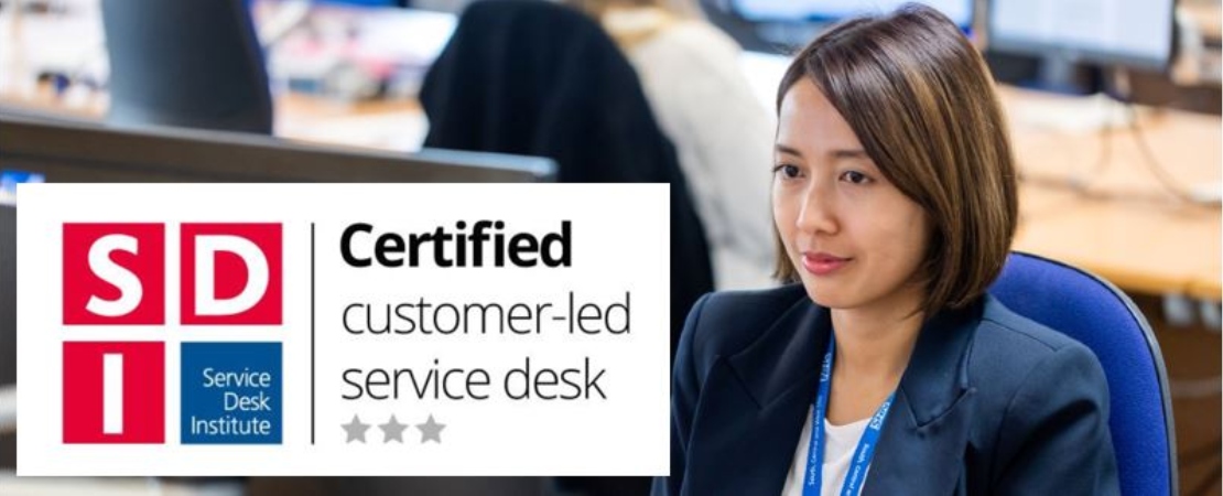  Graphic of service desk institute three star accreditation and person at a computer
