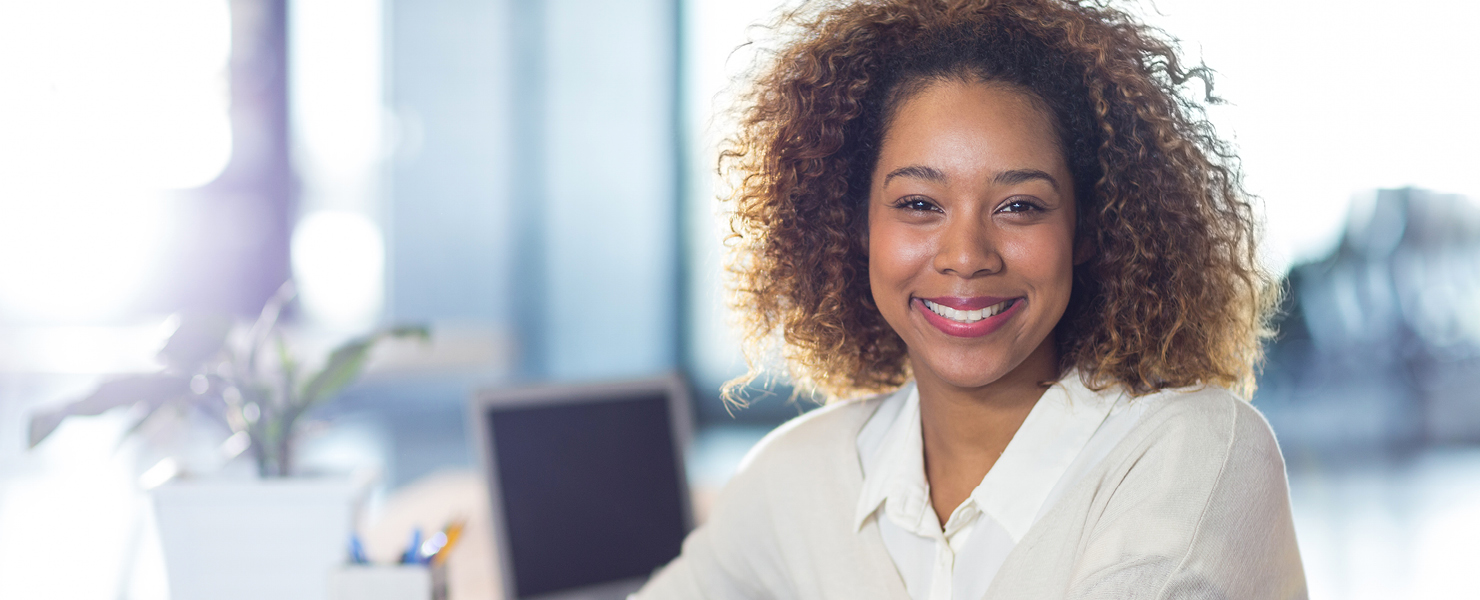 a woman smiling in the office