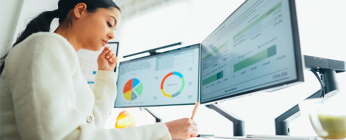 female worker looking at data screens