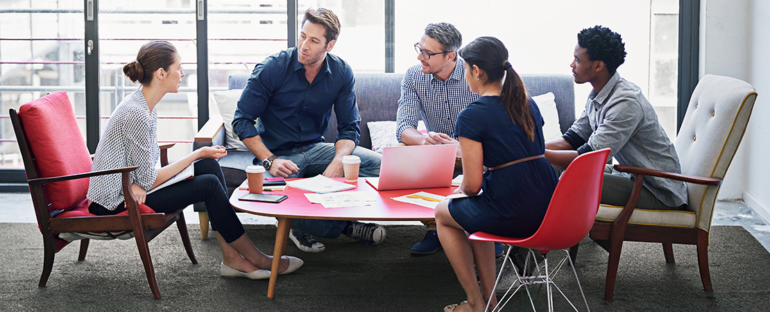 Colleagues talking in the office