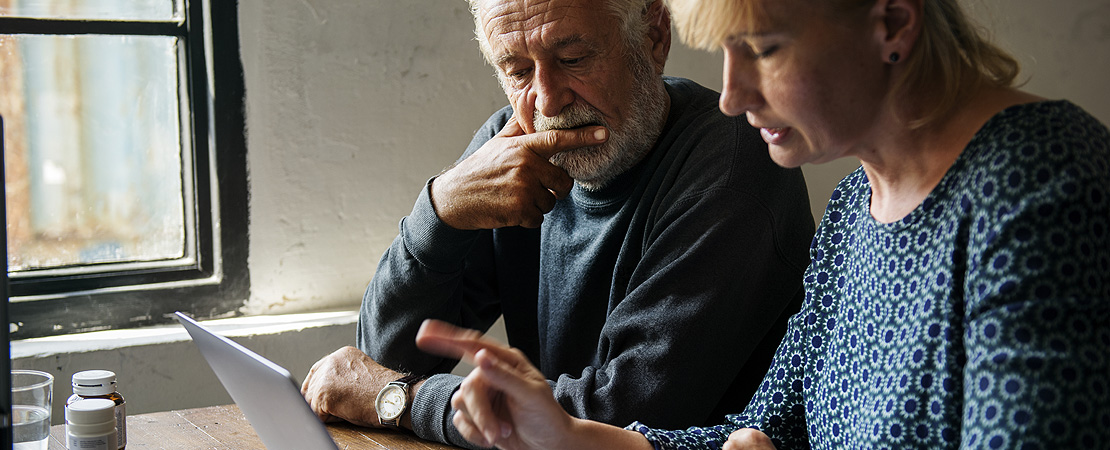 Couple looking at a computer screen