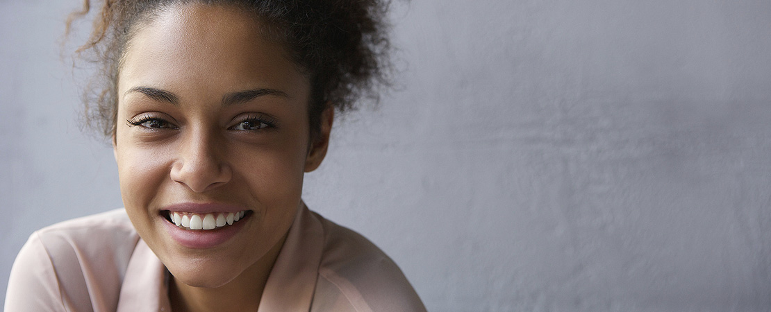 A young woman smiling