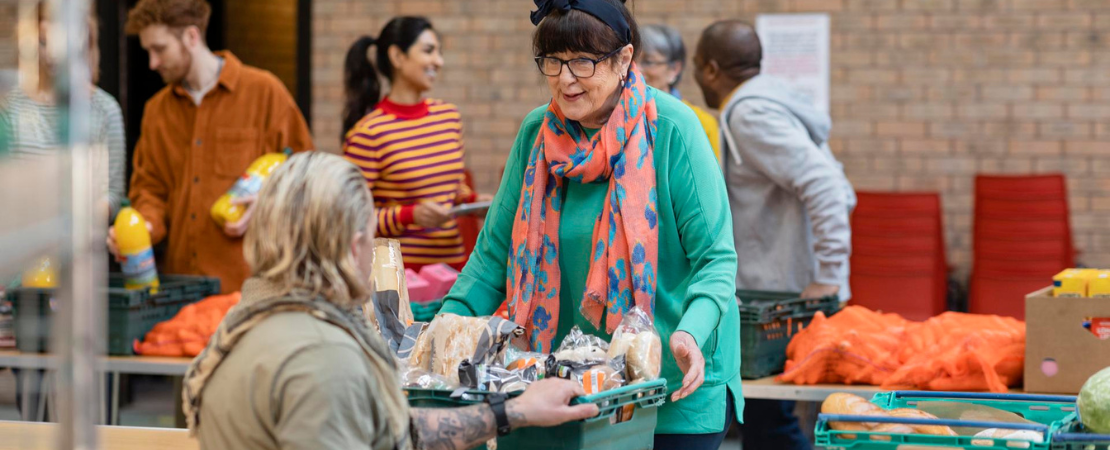 a group volunteers organising food donations