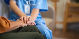 Nurse comforting patient