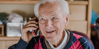 elderly man on phone
