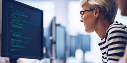 Office worker looking at a screen of data
