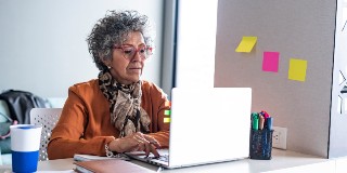 Woman working at home laptop