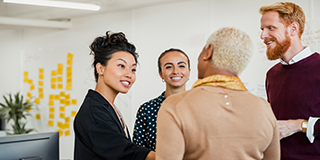 three healthcare professionals talking