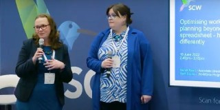 Sarah Reed and colleague speaking at Confed 22