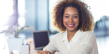 a woman smiling in the office