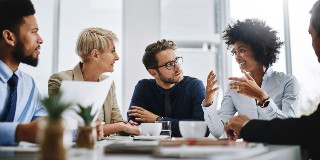 A group of work colleagues talking