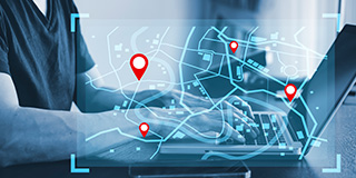 A graphic image of a computer user with a map overlay