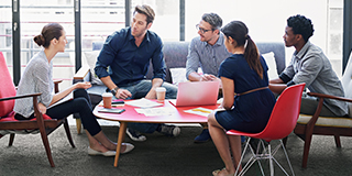 Colleagues talking in the office