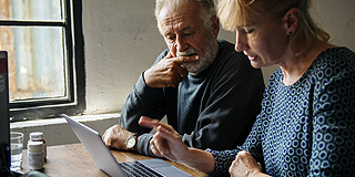Couple looking at a computer screen