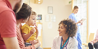 Doctor talking to a family