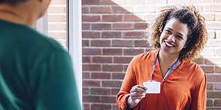 A healthcare worker visiting a patient at home