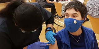 lady being vaccinated